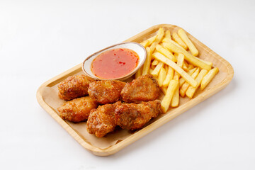 Chicken legs with french fries on a white background