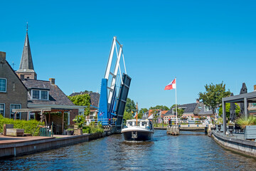 Cruising through the traditional village Warten in Friesland the Netherlands