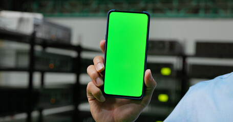 asian investor showing his phone