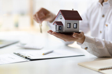 Real estate agent concept for rent, mortgages, home insurance. and signing a house purchase...