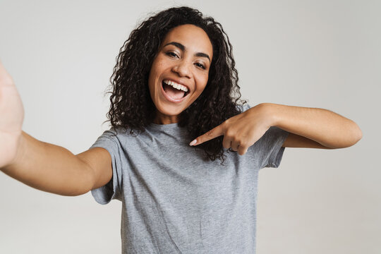 Young Black Woman Pointing Finger At Herself While Taking Selfie Photo