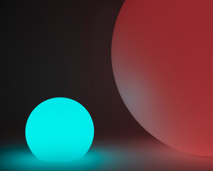 Glowing and illuminated spherical coloured orbs on a black background.