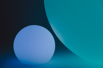 Glowing and illuminated spherical coloured orbs on a black background.