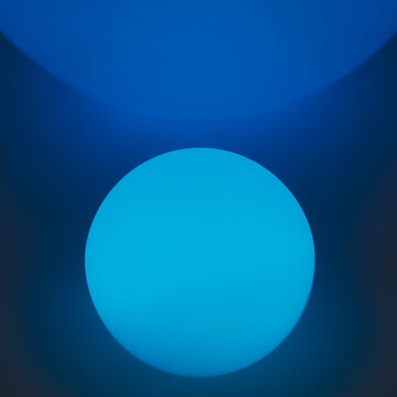 Glowing and illuminated spherical coloured orbs on a black background.