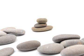 Obraz na płótnie Canvas Zen stones on a light background. Minimalistic concept. Zen balance miditation concept. For branding and product presentation.