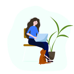 The girl works at a laptop in a cozy environment with a cat and a green plant.