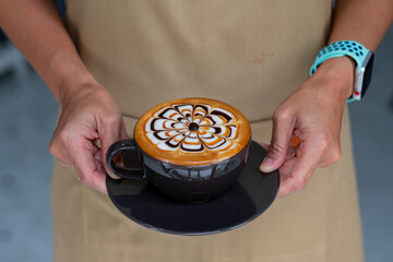 hot latte art coffee on hand table, relax time