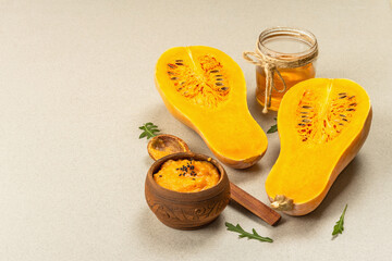 Halves of raw pumpkin with butternut squash puree, honey and fresh herbs. Assortment ingredients
