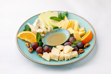 Parmesan cheeses nicely arranged on a plate on a white background