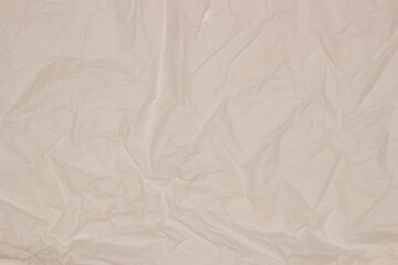 Abstract ivory, off white old wrinkled creased paper texture background. Top view