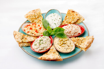 Pita with sauce topping on a white background