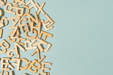 wooden letter all over the green background, alphabet, words