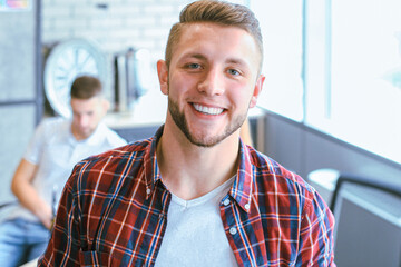 Businessman with colleagues in the background in office