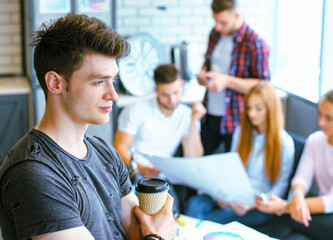 Fototapeta premium Businessman with colleagues in the background in office