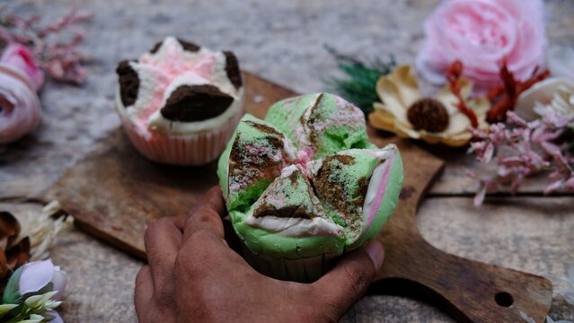 Bolu kukus mawar, Indonesian steamed cake on wooden background