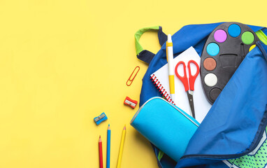 Top view of school backpack and school supplies with space for text. Back to school concept