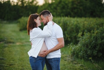 Portrait of lovely future parents during sunset