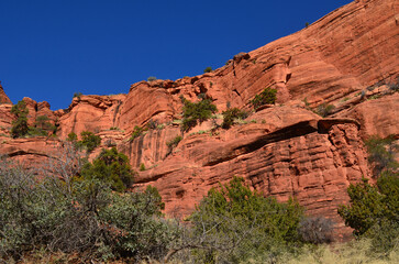 Vibrant Blue Skies Over a Stunning Rock Wall