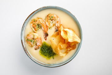cream soup with shrimp isolated on white