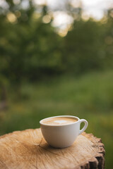 Cup of cappuccino with a heart outdoors