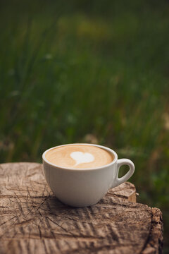 Cup of homemade cappuccino outdoors