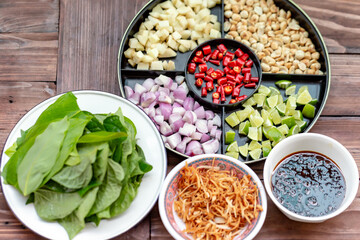 Miang Kham - Appetizer wrapped in betel leaves Thai people like to eat it as a snack.

