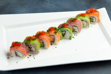 Rolls with avocado, salmon and rice.