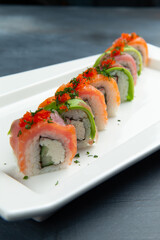Rolls with avocado, salmon and rice.