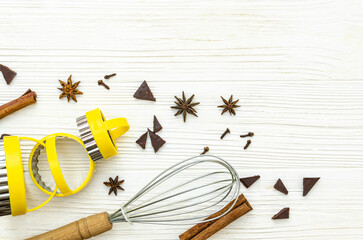 Cooking supplies and ingredients on  wooden table.