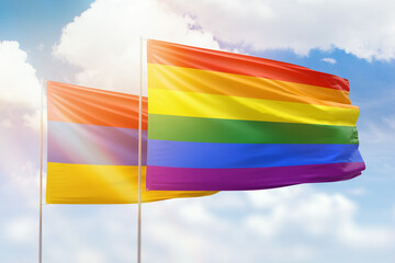 Sunny blue sky and flags of lgbt and armenia