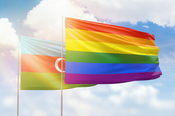 Sunny blue sky and flags of lgbt and azerbaijan