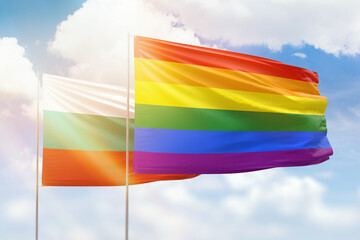 Sunny blue sky and flags of lgbt and bulgaria