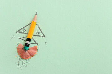 Pencil and rocket sketch over textured paper, concept of back to school, creativity and success