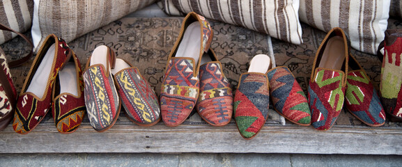 Slippers and shoes made of woven fabric in market in Turkey