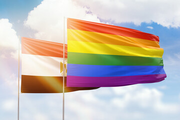 Sunny blue sky and flags of lgbt and egypt