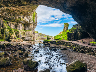 Grotto and Waterfall in Smoo Cave, NC500, North Scotland, UK
