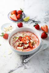 Homemade porridge with strawberry and almond
