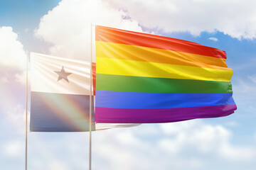 Sunny blue sky and flags of lgbt and panama