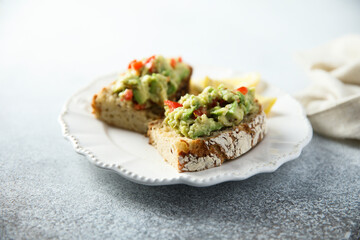 Homemade avocado toast with tomatoes