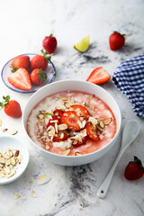 Homemade porridge with strawberry and almond