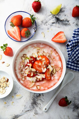Homemade porridge with strawberry and almond