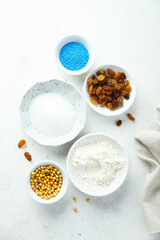 Obraz na płótnie Canvas Baking ingredients on a white table