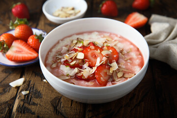 Homemade porridge with strawberry and almond