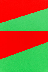 Abstract bright red on green paper vertical background.