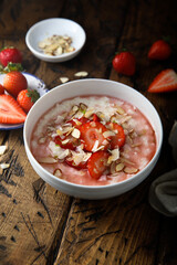 Homemade porridge with strawberry and almond
