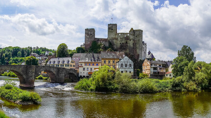 Runkel Castle in Runkel. Old castle on the Lahn with an old stone bridge. Landscape by the river with historic buildings.
