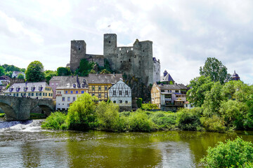 Fototapeta na wymiar Runkel Castle in Runkel. Old castle on the Lahn with an old stone bridge. Landscape by the river with historic buildings. 