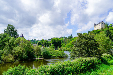 Fototapeta na wymiar Schadeck Castle in Runkel. Green landscape on the Lahn with the old castle on a hill. 