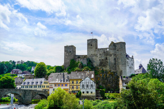 Runkel Castle in Runkel. Old castle on the Lahn with an old stone bridge. Landscape by the river with historic buildings.

