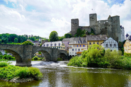 Runkel Castle in Runkel. Old castle on the Lahn with an old stone bridge. Landscape by the river with historic buildings.
